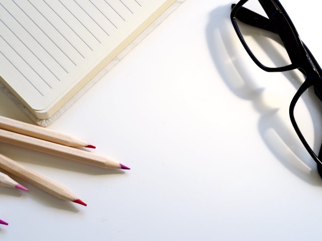 Black Framed Eyeglasses on Desk